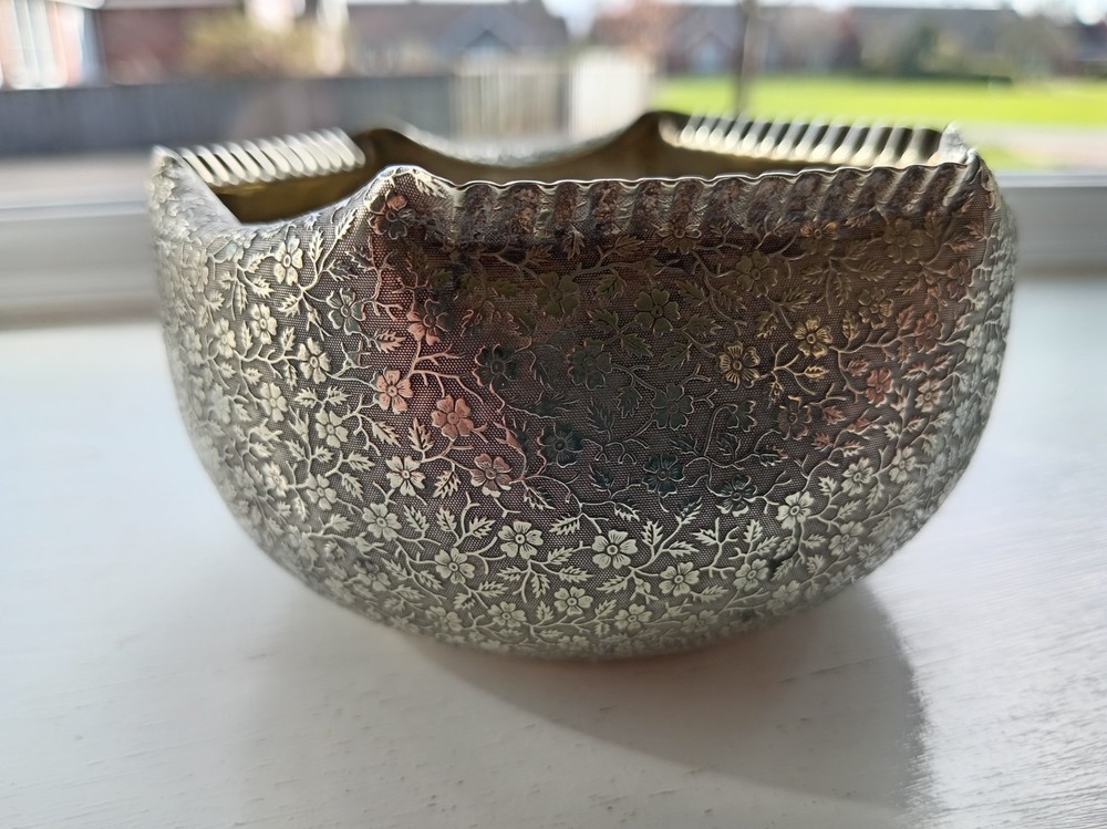 Silver plated very ornate rose bowl.