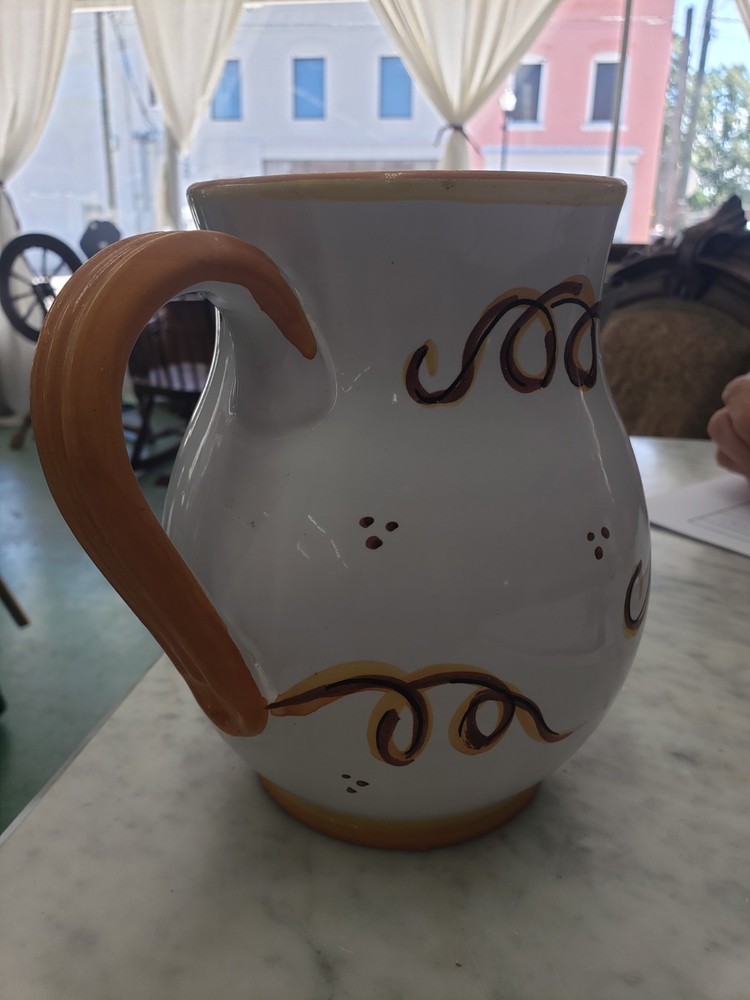 Hand painted, signed, ceramic pitcher,