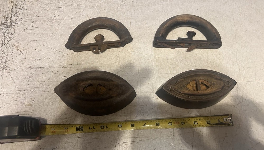 2 OLD SAD IRONS
