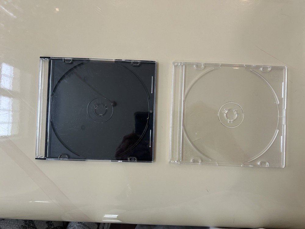 TWO (2) SLIM (ABOUT 1/4") CLEAR CD CASES
