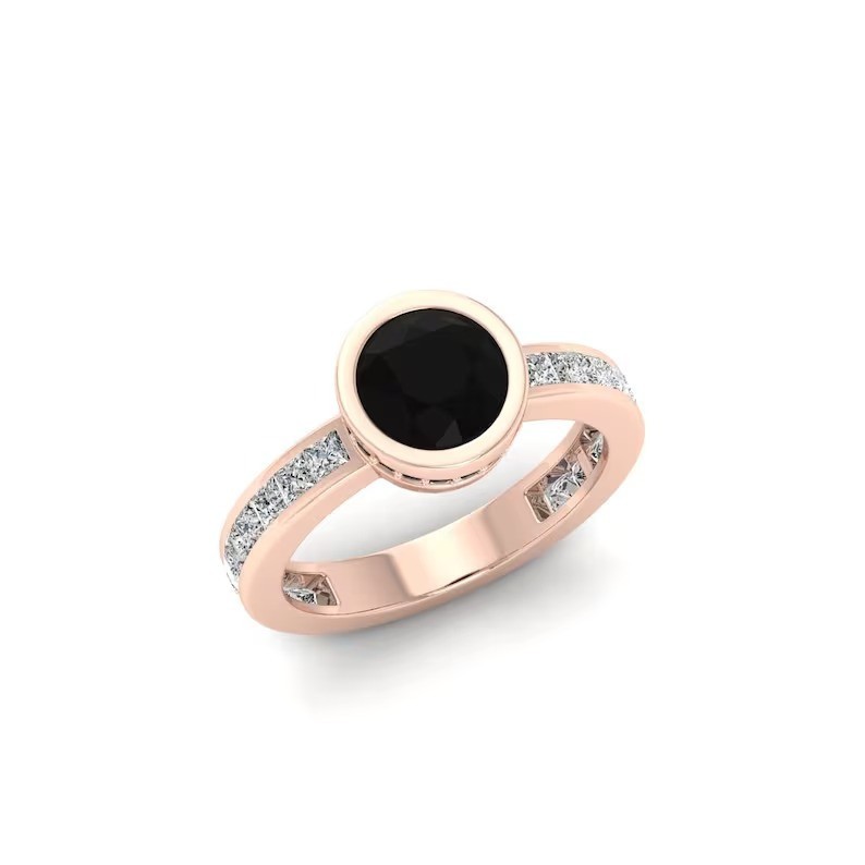 Make a statement with this stunning rose gold ring featuring a round black gemst