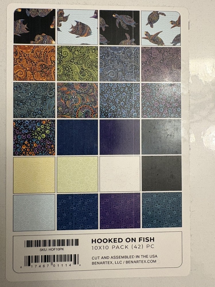 Hooked on fish layer cake quilting fabric. New
