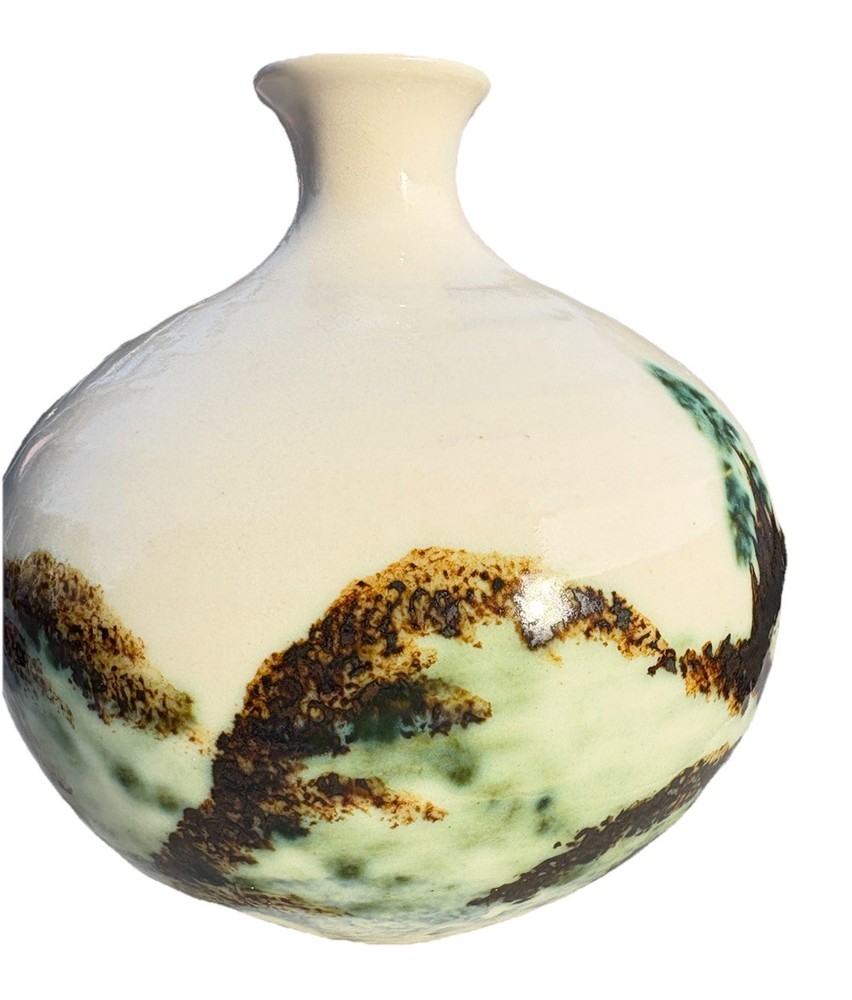 ceramic vase with an "Evergreen" design, featuring a water etching