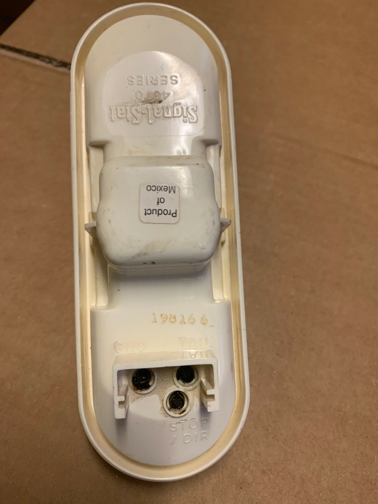 ONE GENUINE SIGNAL-STAT ORANGE STOP TURN TAIL LIGHT 4073