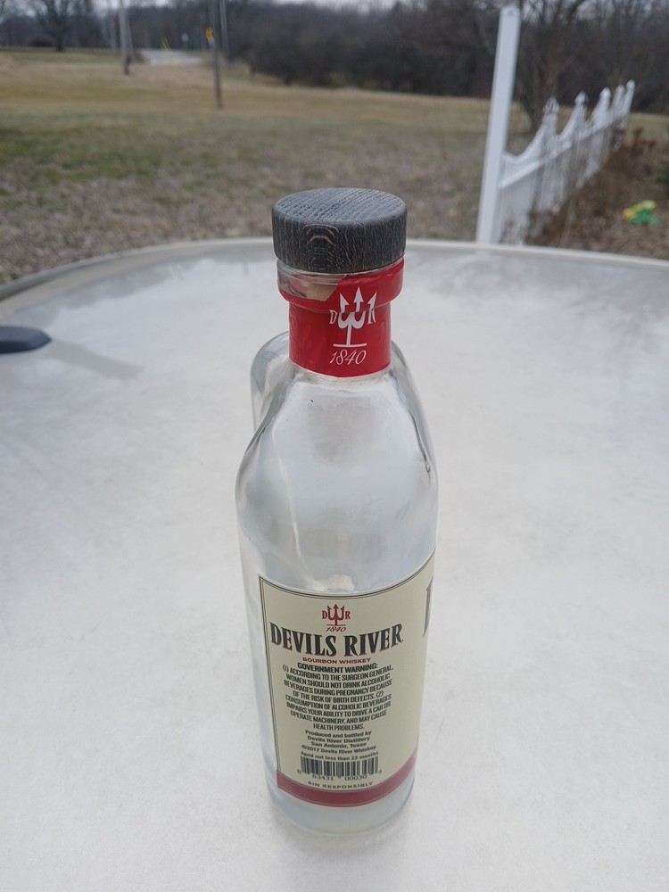 Empty Corked Bottle Of Devil's River Barrel Bourbon Whiskey