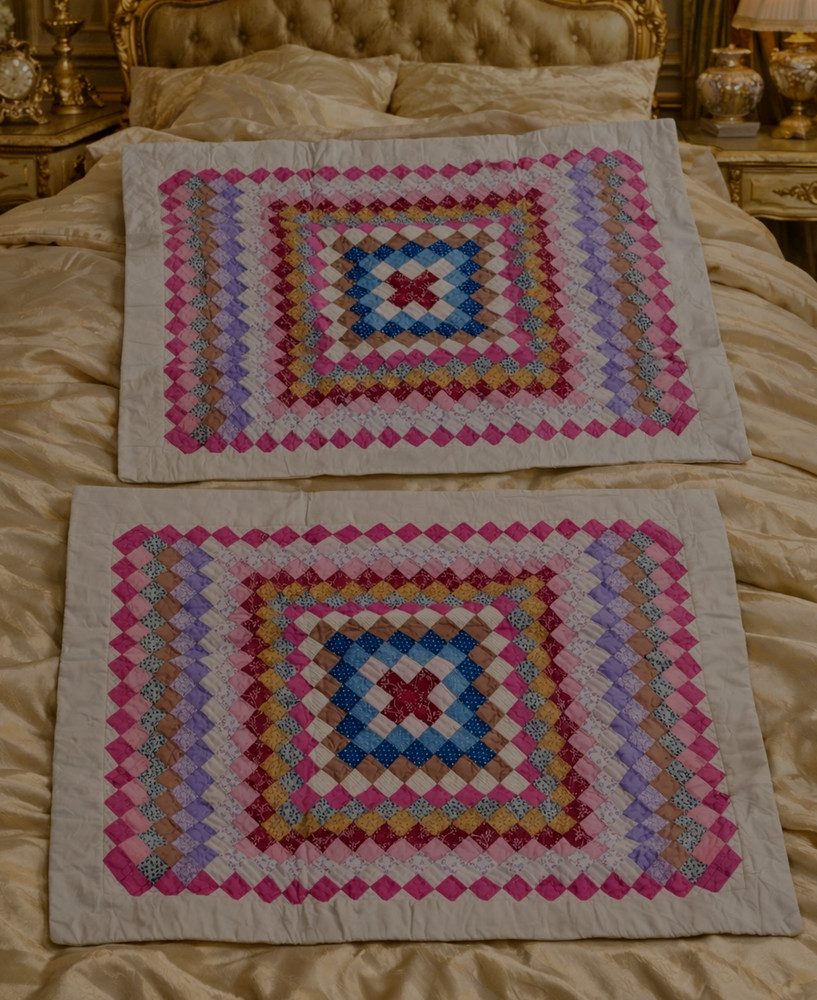 Two quilted patchwork pillow shams, 20" × 26"