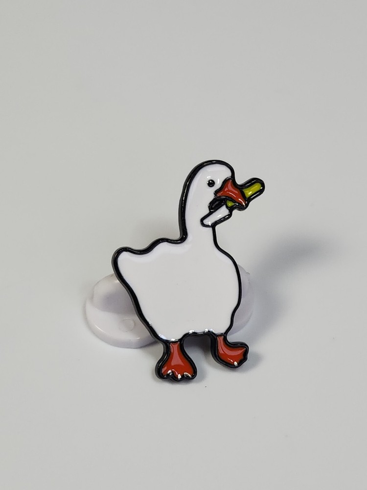 White Duck Holding a Knife Lapel Pin