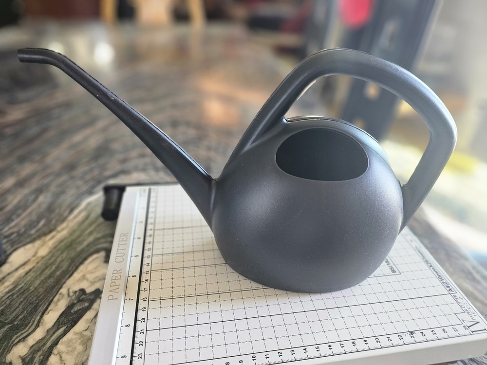 Watering can in blue or black