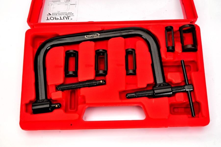 Valve spring release press