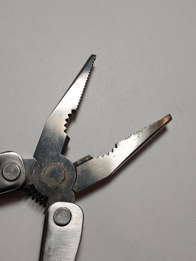 Stainless Steel Multi Tool advertising Rayovac