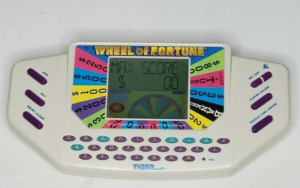 Wheel Of Fortune Handheld Electronic Game by Tiger Electronics 1995 Tested