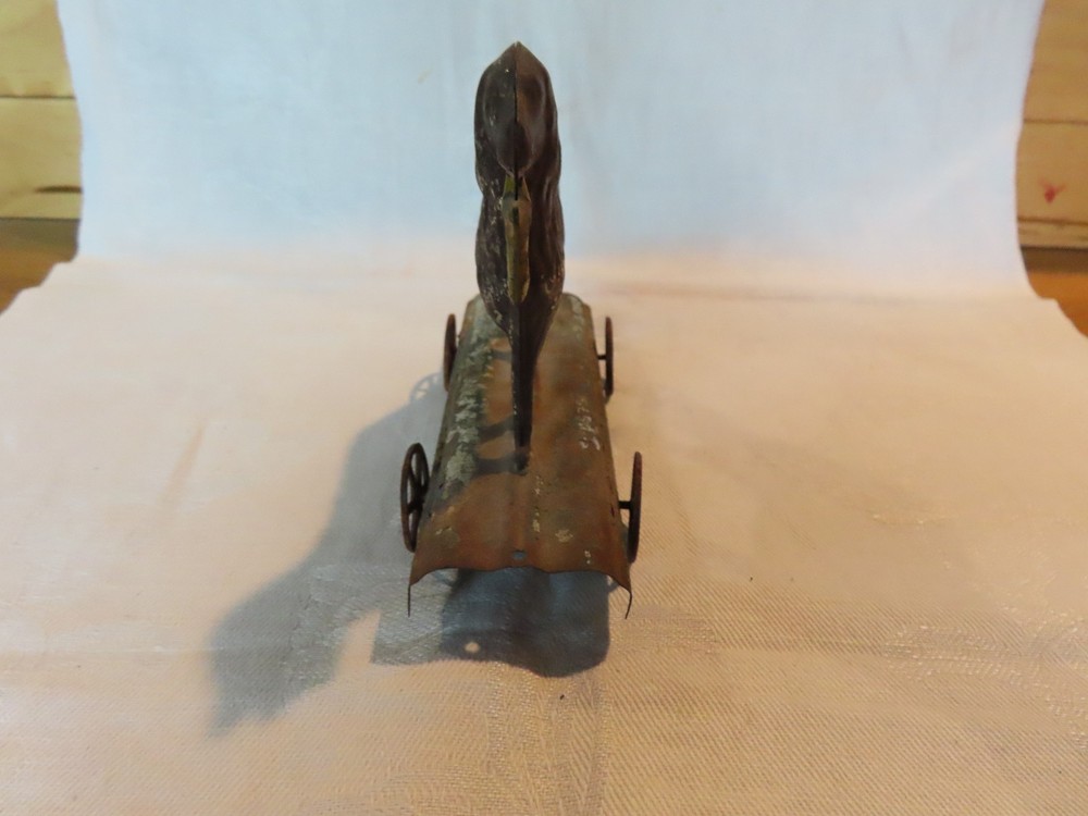 Antique tin dog pull toy