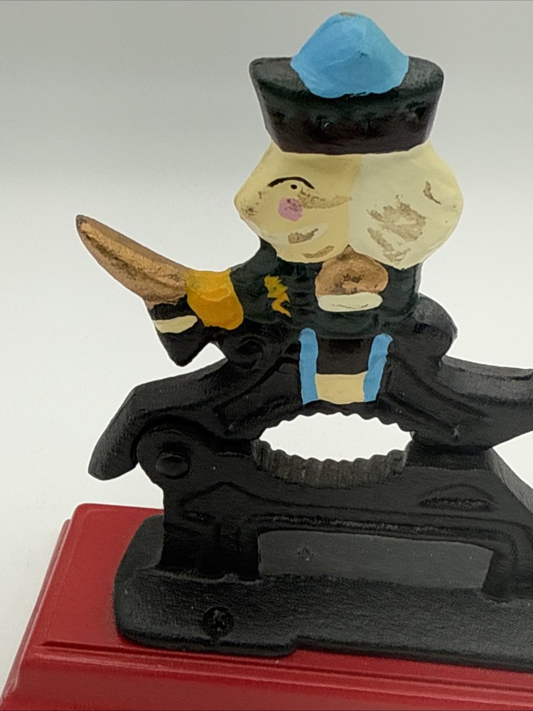 Vintage Cast Iron Nutcracker w/ Hand-Painted Nutcracker Soldier on Red Base