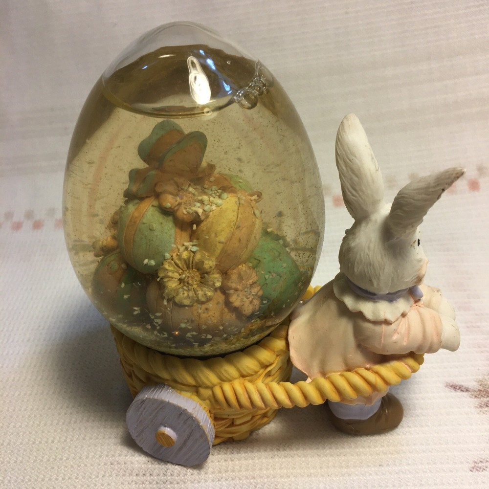 Rabbit Pulling Cart Snow globe Filled With Easter Eggs. Super Cute