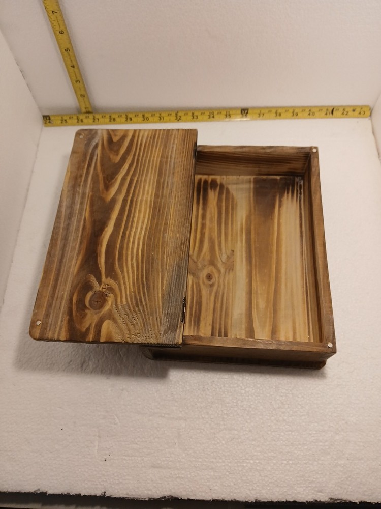 small wooden box with hinged lid