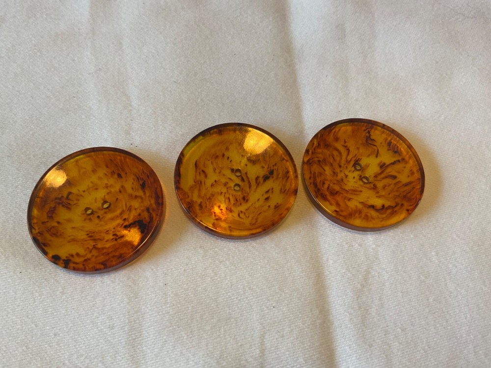 THREE TRANSLUCENT AMBER COLOR BUTTONS 1. 5/16”