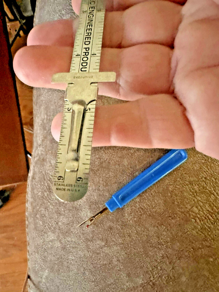 Garlock Slide Ruler and a Seam Ripper