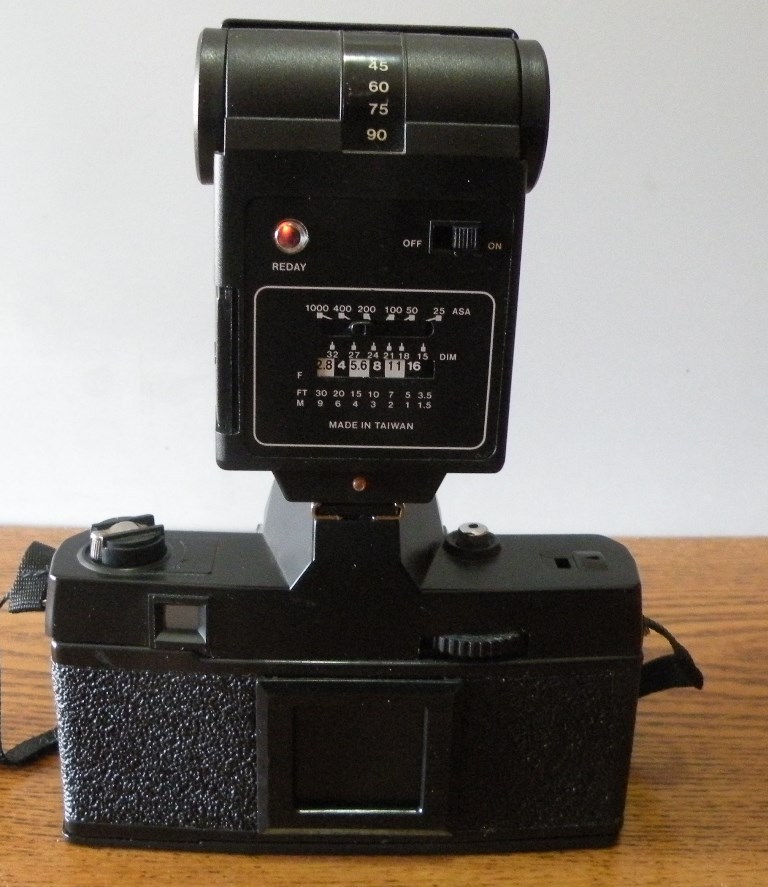 Minotex 2000 35MM camera with flash attachment and case in original box