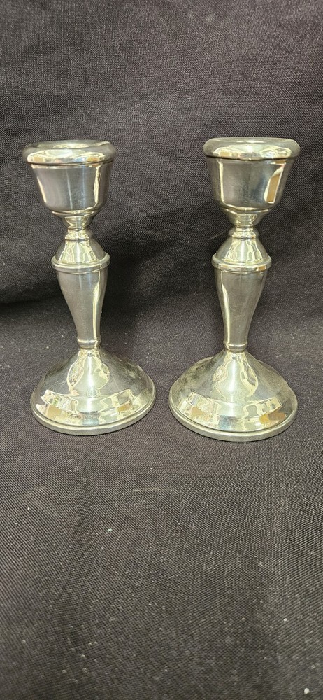 A Pair Of Antique Silver Candlesticks