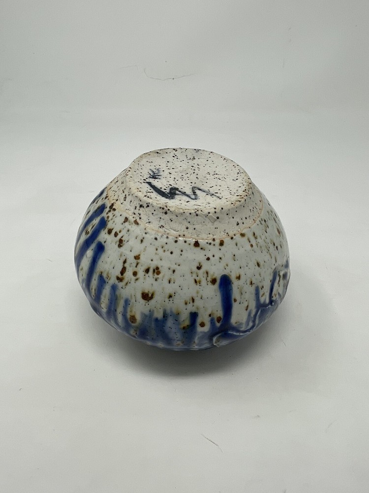 Pottery vase blue with brown specs .