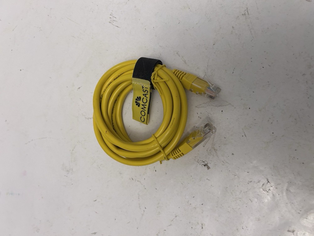 yellow comcast ethernet cord wrapped