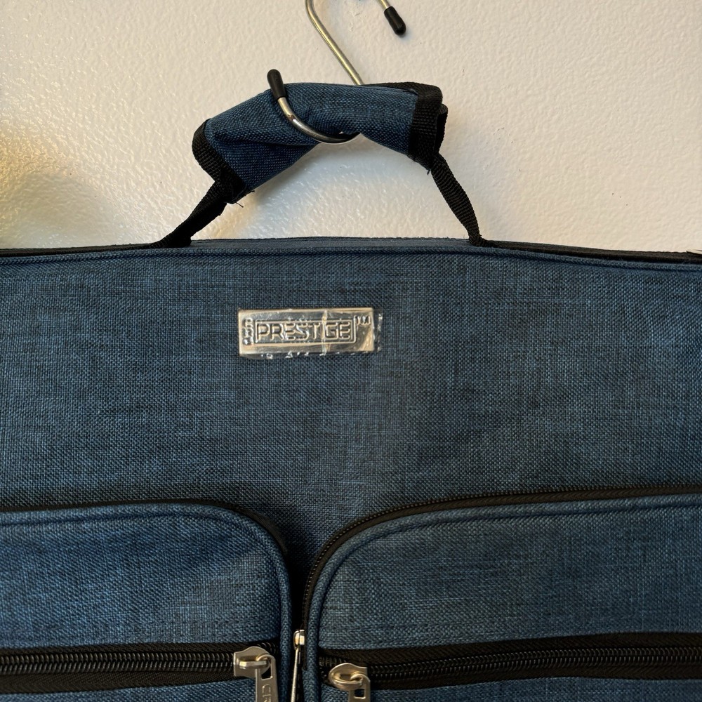 Prestige Foldable Garment Blue Bag with Multiple Zipper Pockets.