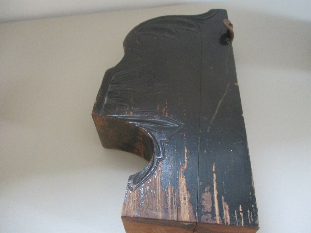 Antique painted black corbel.