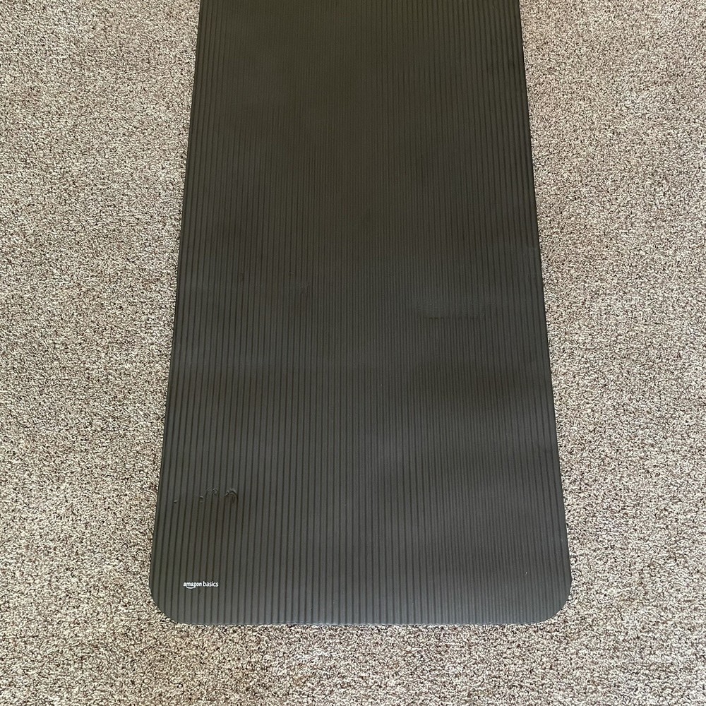 Amazon Basics 1/2-Inch Extra Thick Exercise Yoga Mat with Carrying Straps.
