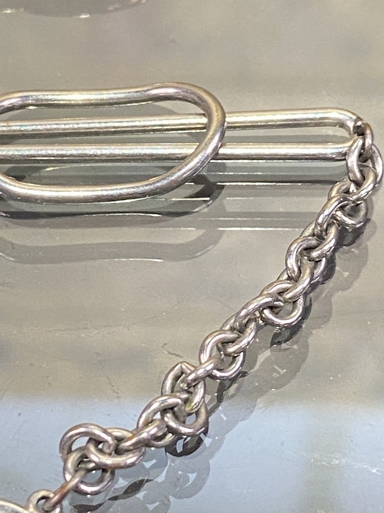 Two Tie Clips, One Marked Anson