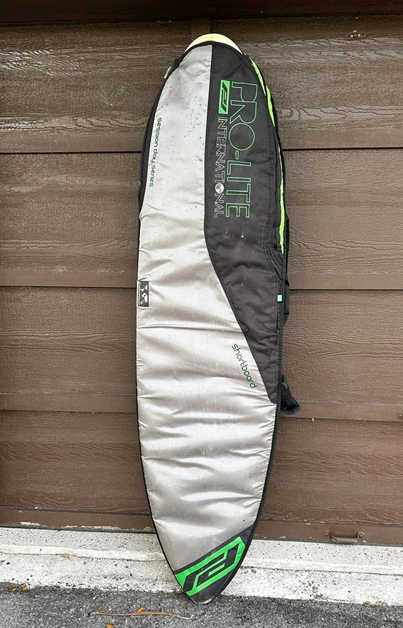 YANCER Surfboard and a cover
