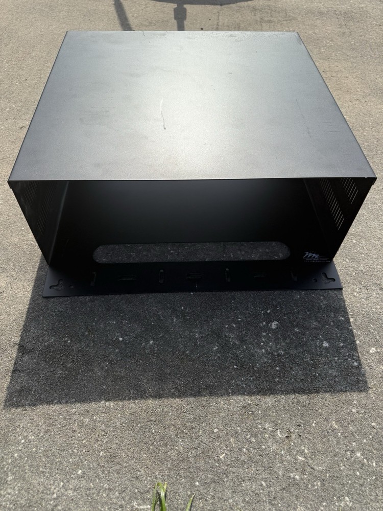 4RU vertical wall mount rack for network equipment and patch panels.