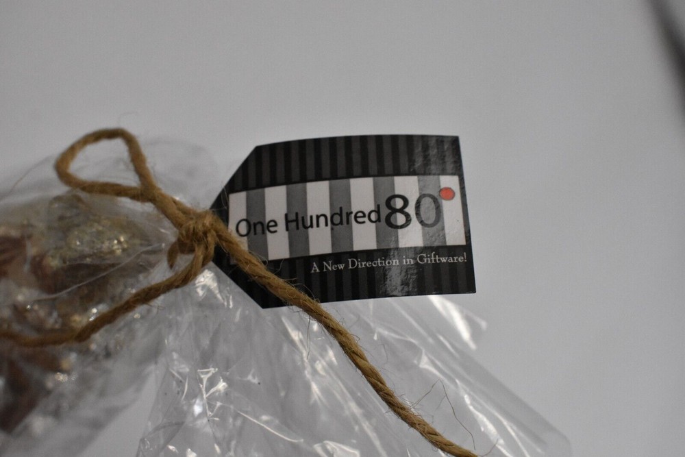 One Hundreds Eighty Degree Golden Pine Cone Candle 5.75"