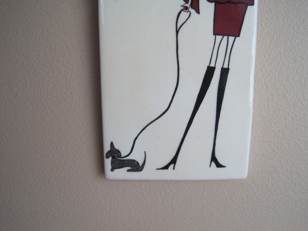 Lady with a dachshund tile.