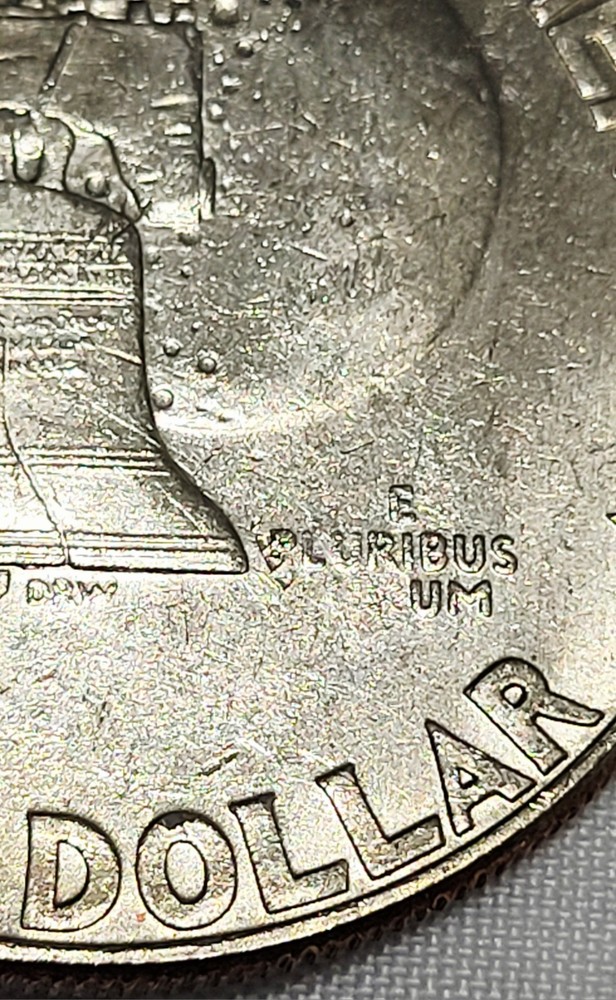 1976D Ike Select Uncirculated Struck Through Grease Reverse Motto #01.04.26f