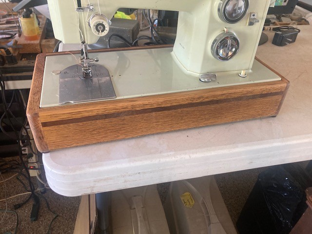Solid oak and walnut sewing machine bases, custom built to fit your machine.