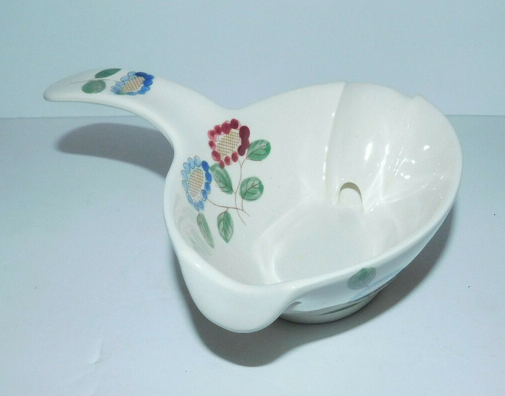NEAT GRAVY BOAT OR SERVER WITH SIDE HANDLE AND FLORAL DESIGN