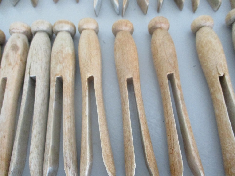 Antique Primitive wood clothes pins. Knobs on top.Two different styles. 46 total