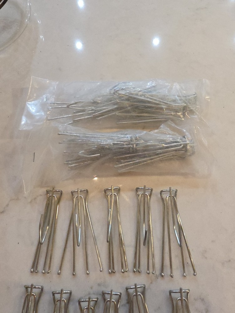 14 curtain hooks 4 prongs with extra hook on bottom.