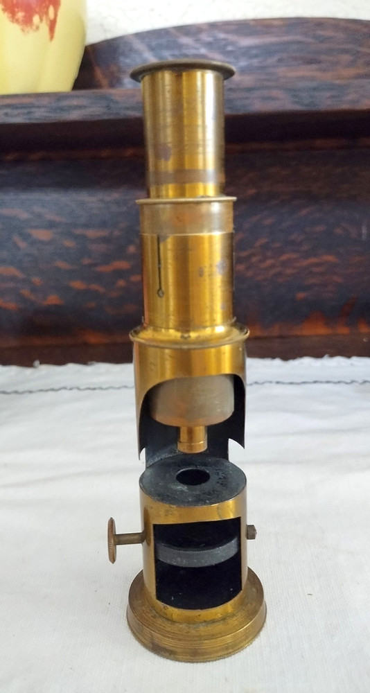 Old brass field microscope