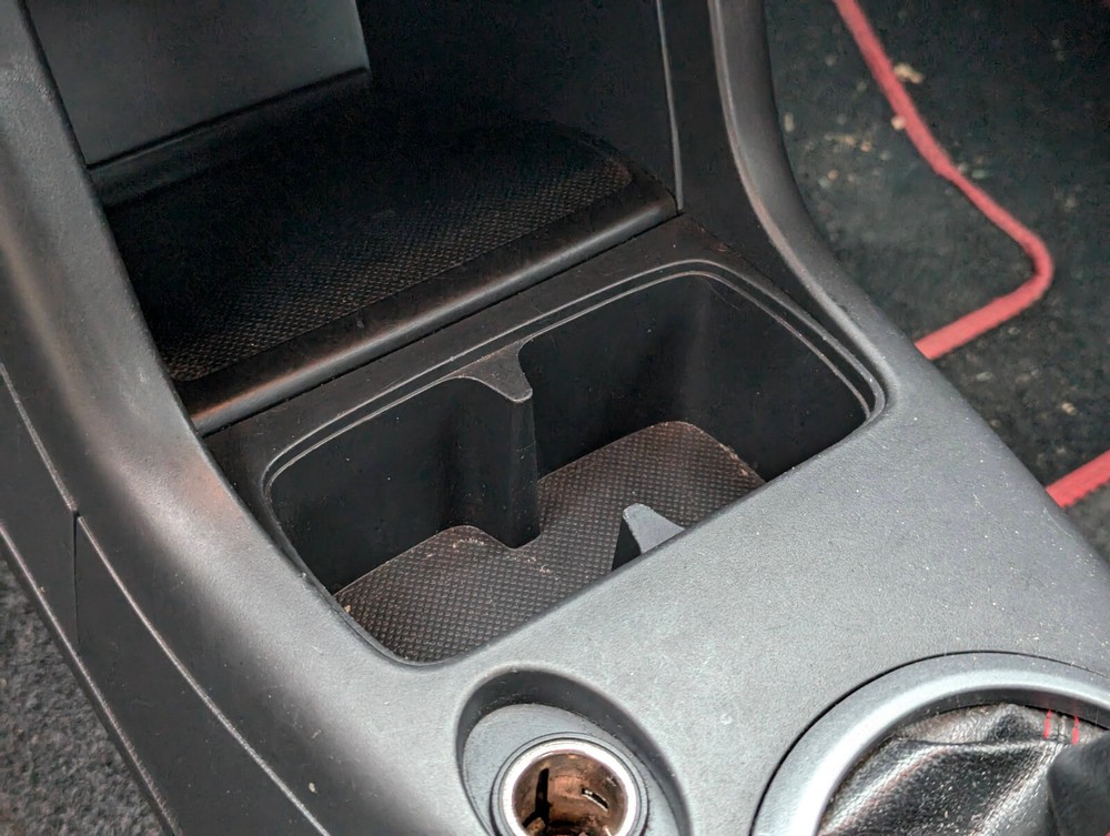 Cup holder insert for Suzuki Swift 2005-2010.