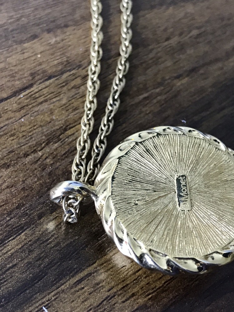 Monet Gold tone Necklace with round Pattern Pendant