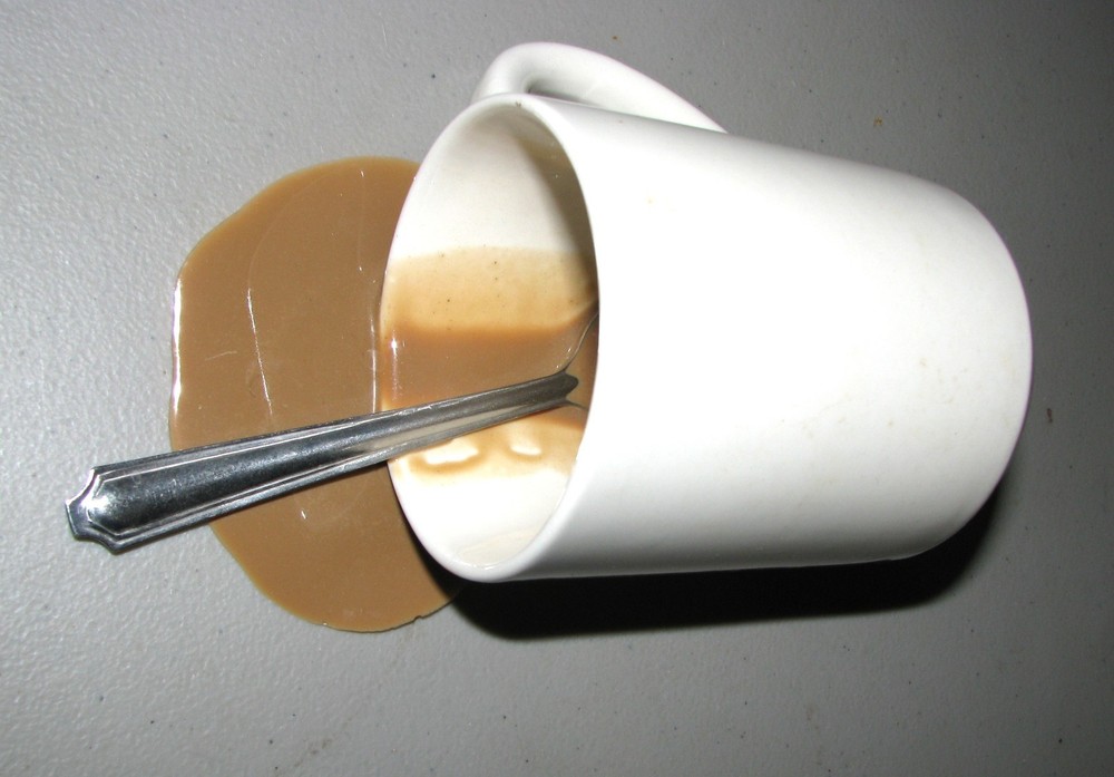 Fake Spilled Coffee Mug Display with Spoon