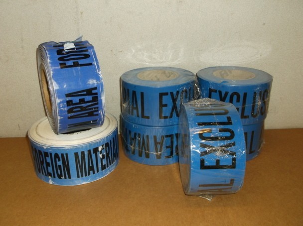7 Blue Caution Tape Rolls That Read "Foreign Material Exclusion Area"