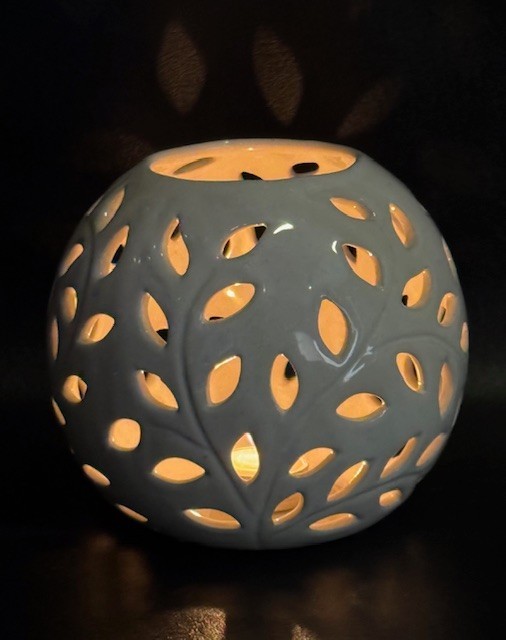 Decorative Round Candle or Tealight Holder with Leaves Design.