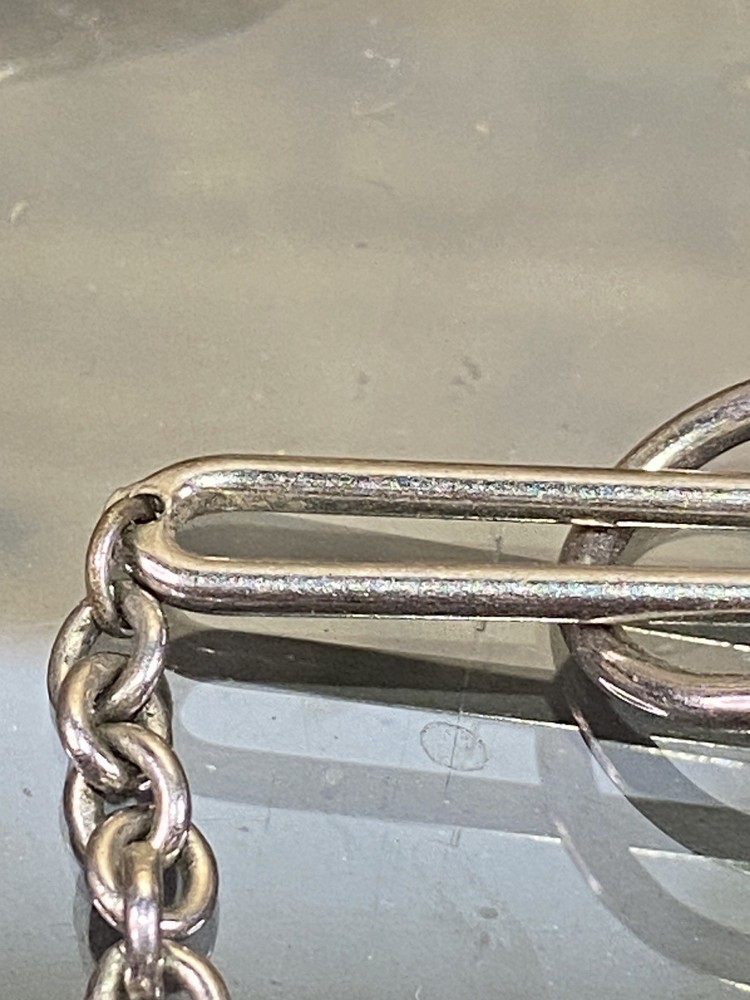 Two Tie Clips, One Marked Anson