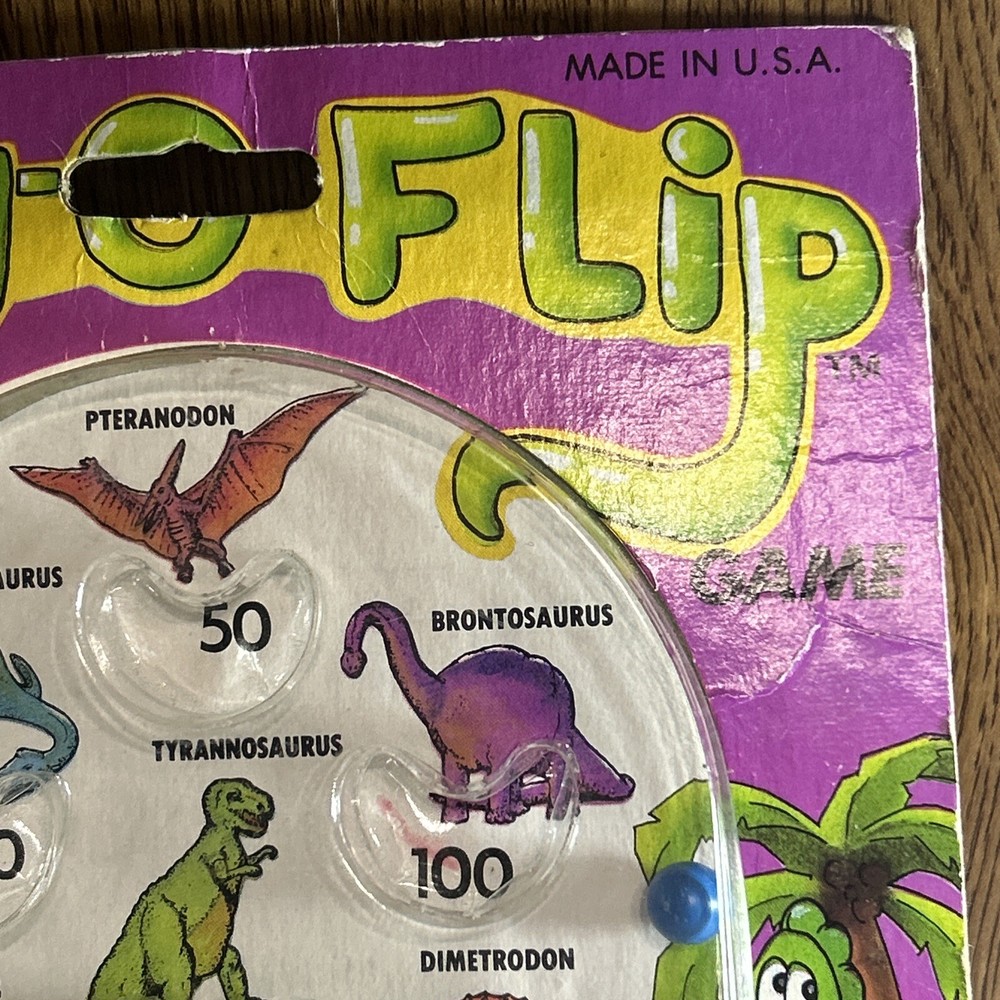 Vintage 1987 Din-o-Flip Handheld Game.