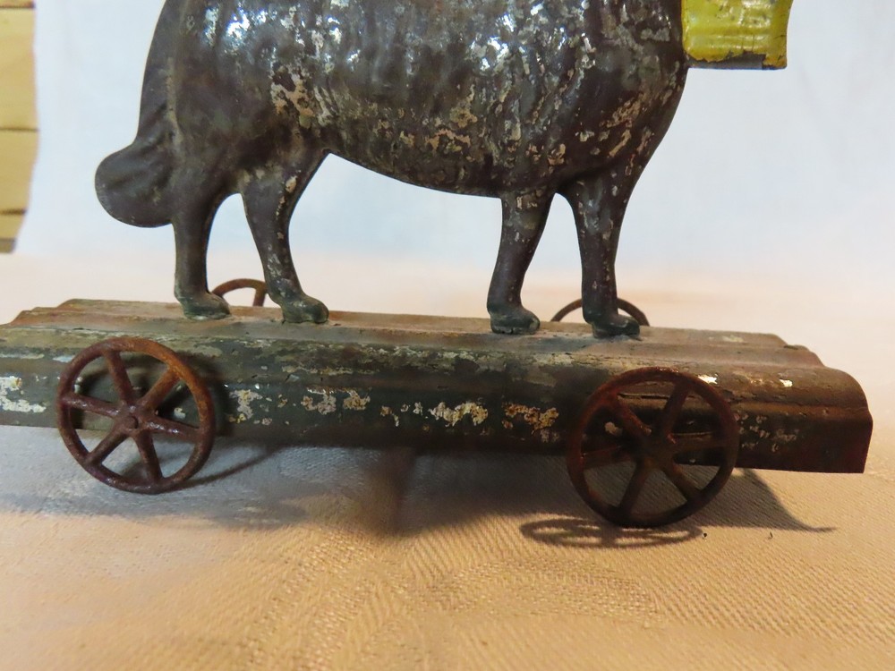 Antique tin dog pull toy
