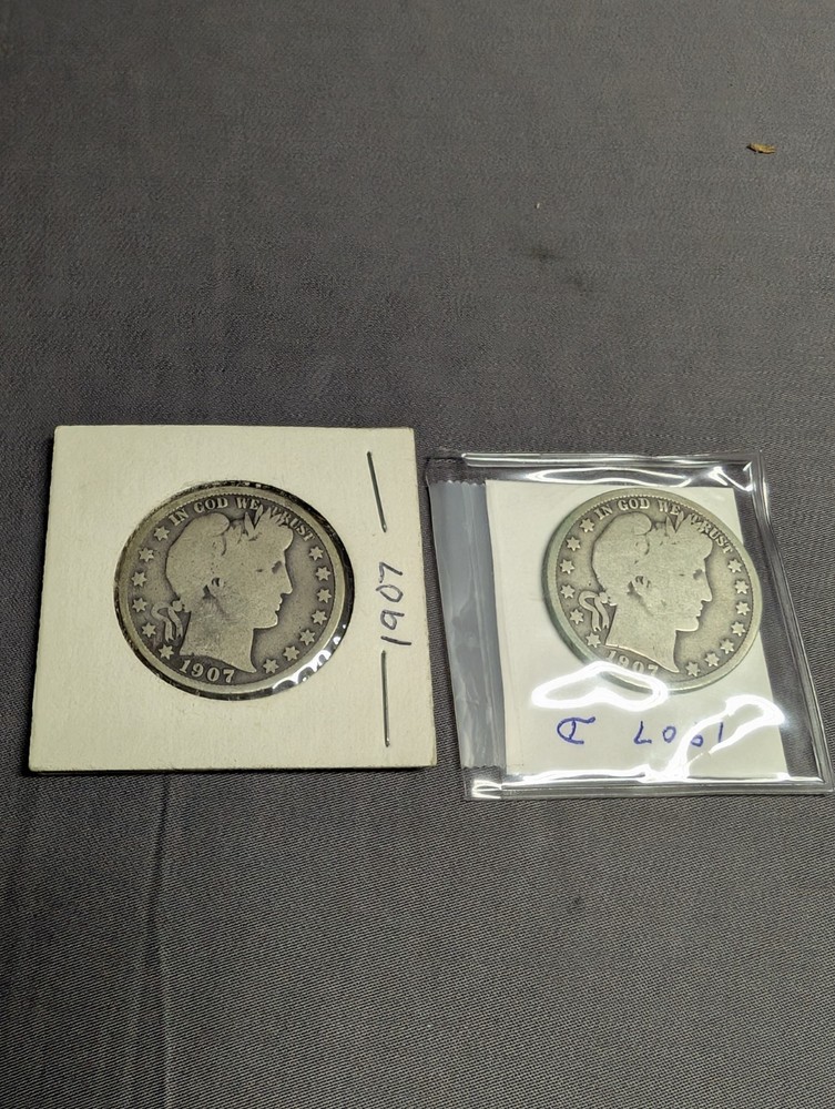 Two 1907 Barber Liberty Half Dollar Coins.