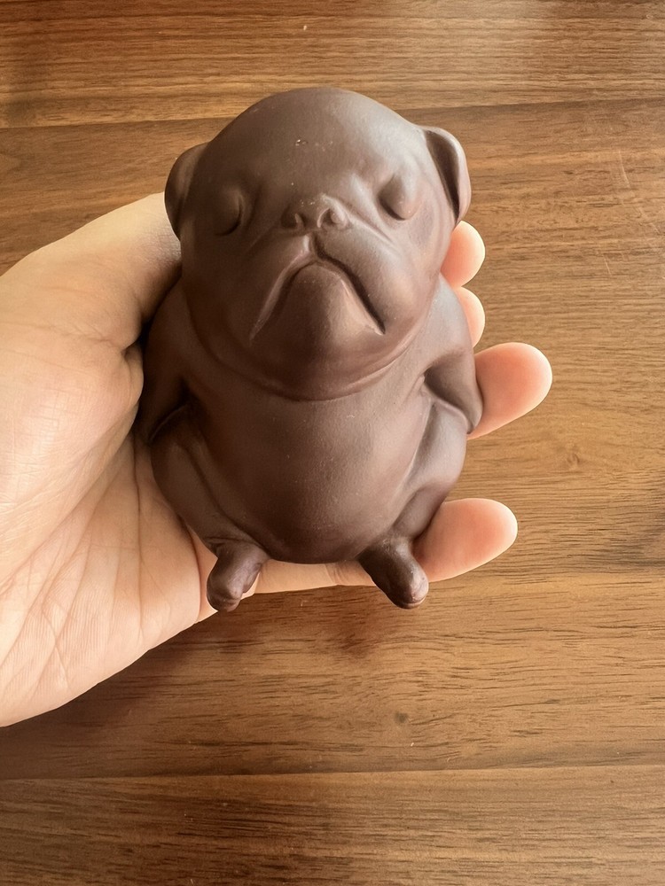 Purple clay ceramic puppy.