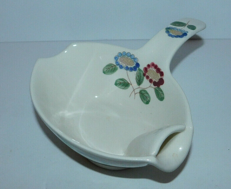 NEAT GRAVY BOAT OR SERVER WITH SIDE HANDLE AND FLORAL DESIGN